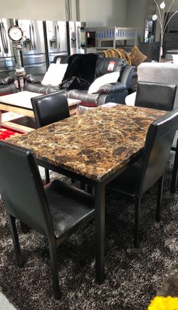 Dining table with four chairs on sale for $289