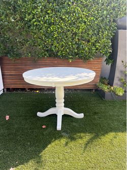 White wood round table