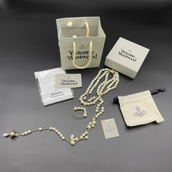 Vivienne Westwood Irregular Three Row Pearl Bas Relief Choker in gold