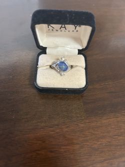 Ring with  Star Sapphire, And Surrounded By Smaller Crystals From Kay Jewelers