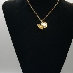 Gold floral locket necklace