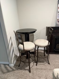 Bistro Table with two swivel chairs