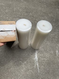 Two White Medium Sized Candles