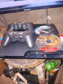 Ps3 with 4 games 3 controlers