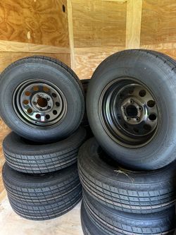 New  205/75R15 Tire on 5-Lug Steel Rim