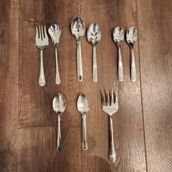 various stainless steel flatware & serving pieces, spoons, forks, and a cocktail fork, great condition
