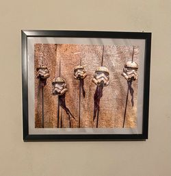 Star Wars Storm Troopers Helmets On Spike Art Piece in black Frame