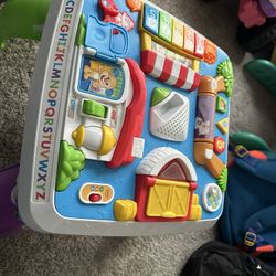 Fisher-Price Laugh & Learn Baby to Toddler Toy, Around the Town Learning Table with Music Lights & Activities for Ages 6+ Months