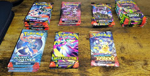 *20 Various pokemon sealed packs.