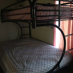 bed bunk with couch underneath