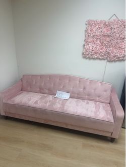 Pink couch and bed