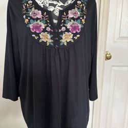Embroidered black top for woman 2X. Preowned in excellent condition. 85% polyester, 15% rayon. Feels like cotton. Comes from a smoke free environment.
