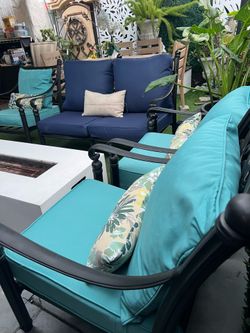 Beautiful 4-piece cast aluminum patio set with new cushions.