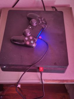 Ps4 console w/ controller and wires.