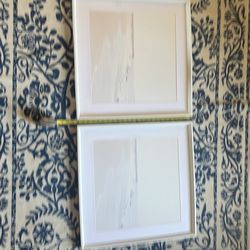 Two framed white ocean pictures