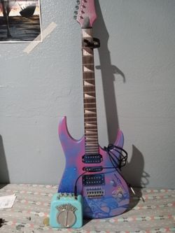 Electric guitar with amp and cord