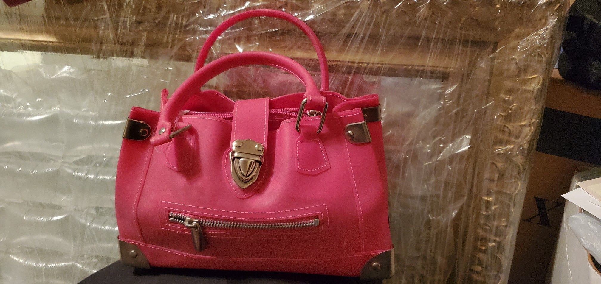 Fun pink plastic hand bag silver hardware.