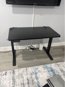 Black rising desk