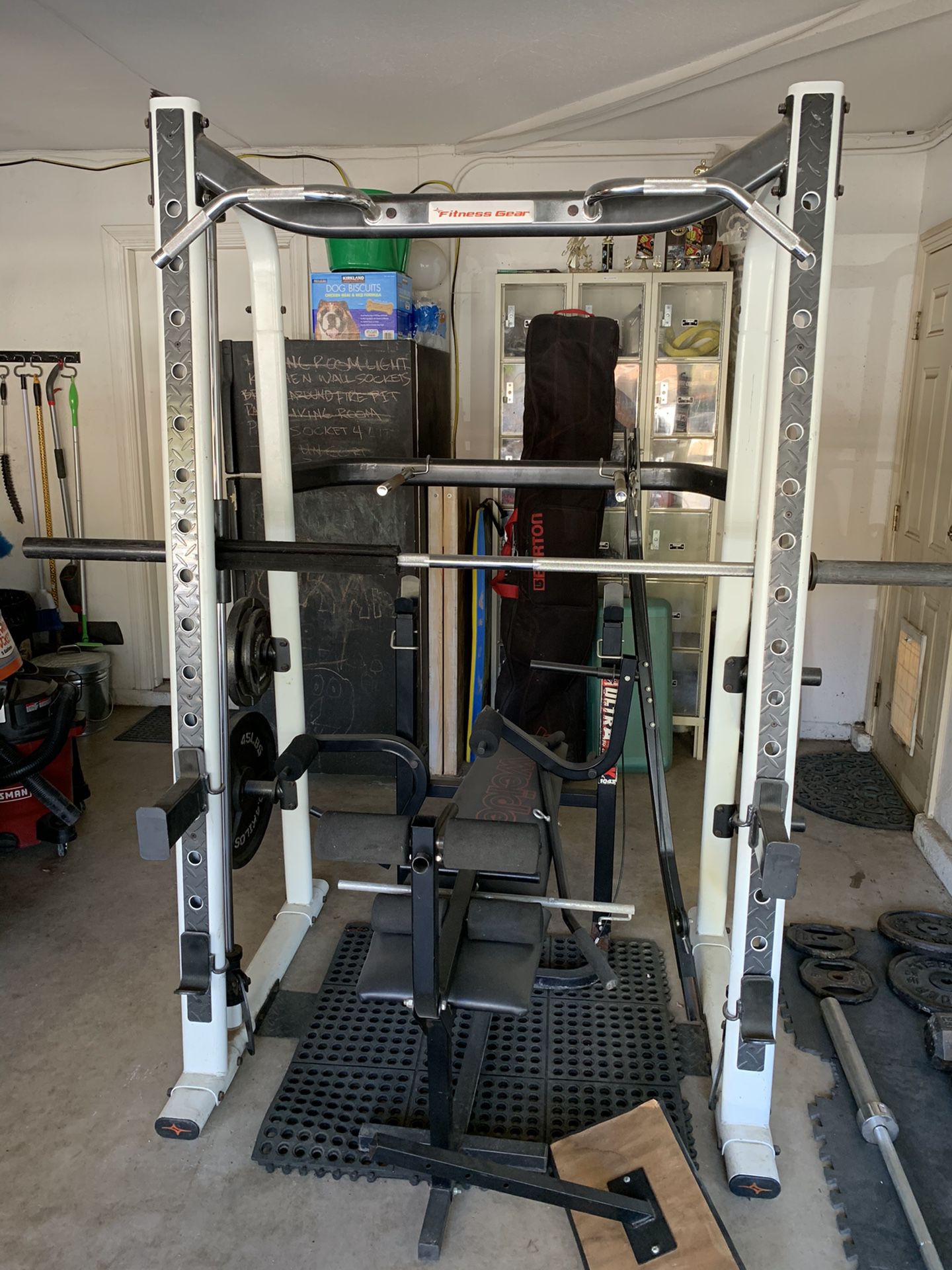 Fitness Gear “smith machine” bench, weights and dumbells