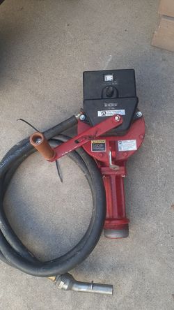 Hand pump with meter hose and nozzle