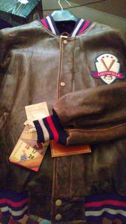 Louisville slugger jacket signed by Pete rose and Johnny vandermere