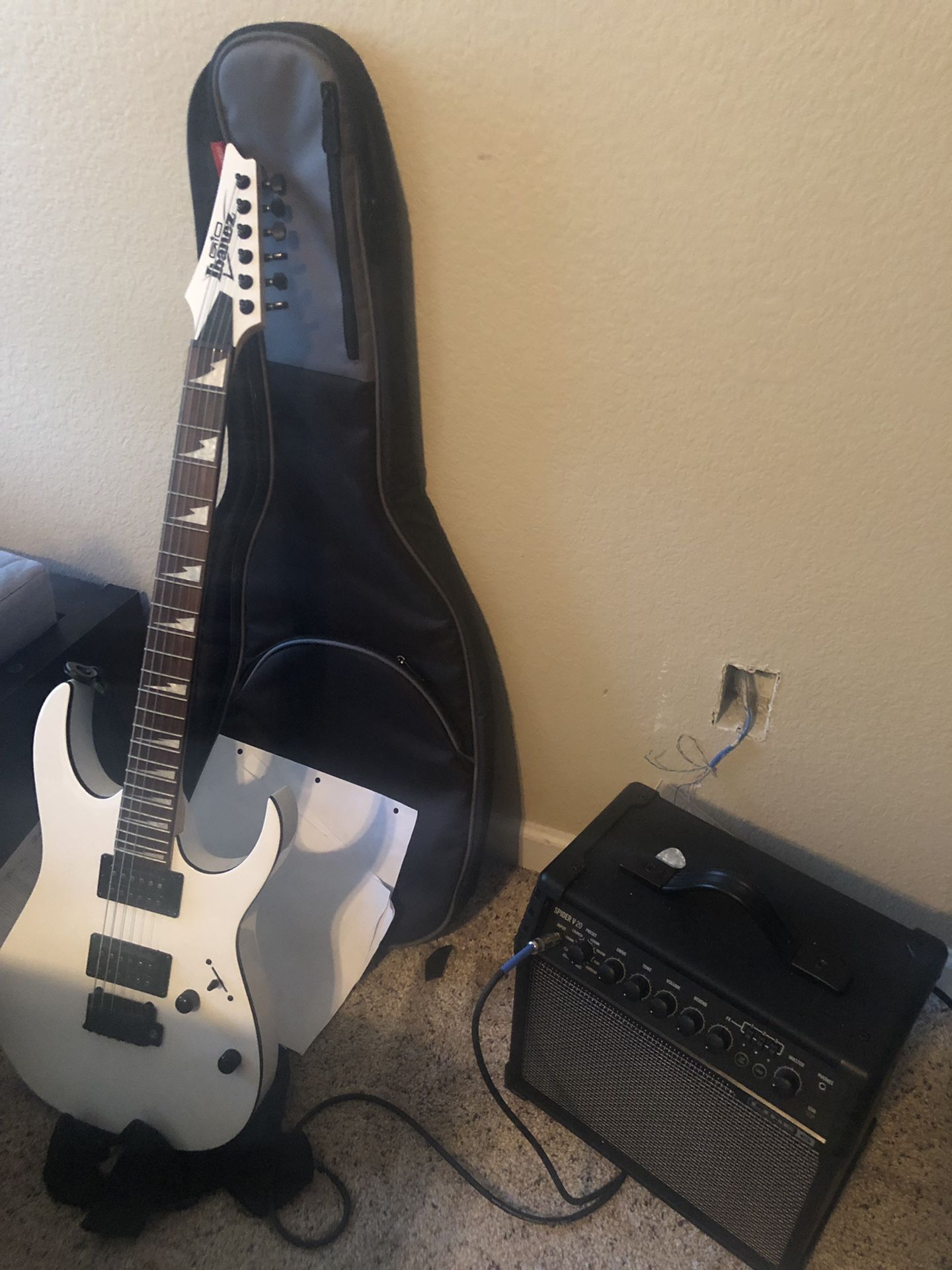 Ibanez electric guitar, case, and amp