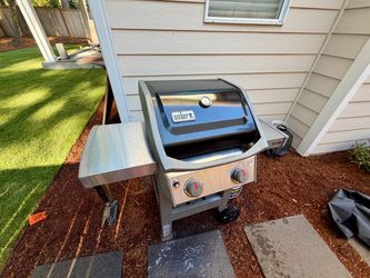 Weber Spirit 2-Burner Gas Grill with cover and full propane tank
