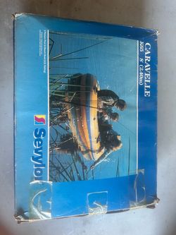 a Sevylor Caravelle K65 3-person inflatable pool and beach boat measuring 8 feet (2.40 meters)