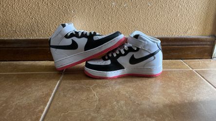 These are Nike Air Force 1 '07 Mid Electric sneakers in a white, black, volt, and hyper pink colorway.