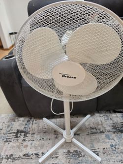 Hawaiian Breeze standing pedestal fan in good used condition. Features three fan speeds (Low, Medium and High), oscillating function, adjustable heigh