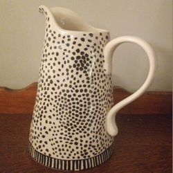 Large unique pitcher with decorative black polka dots