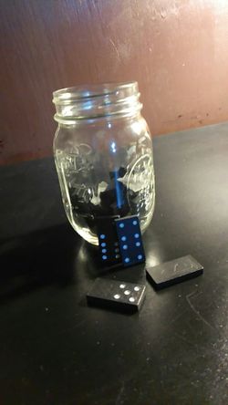 Jar of black pockedoted white Domino's