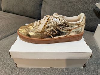 Gold tennis shoes