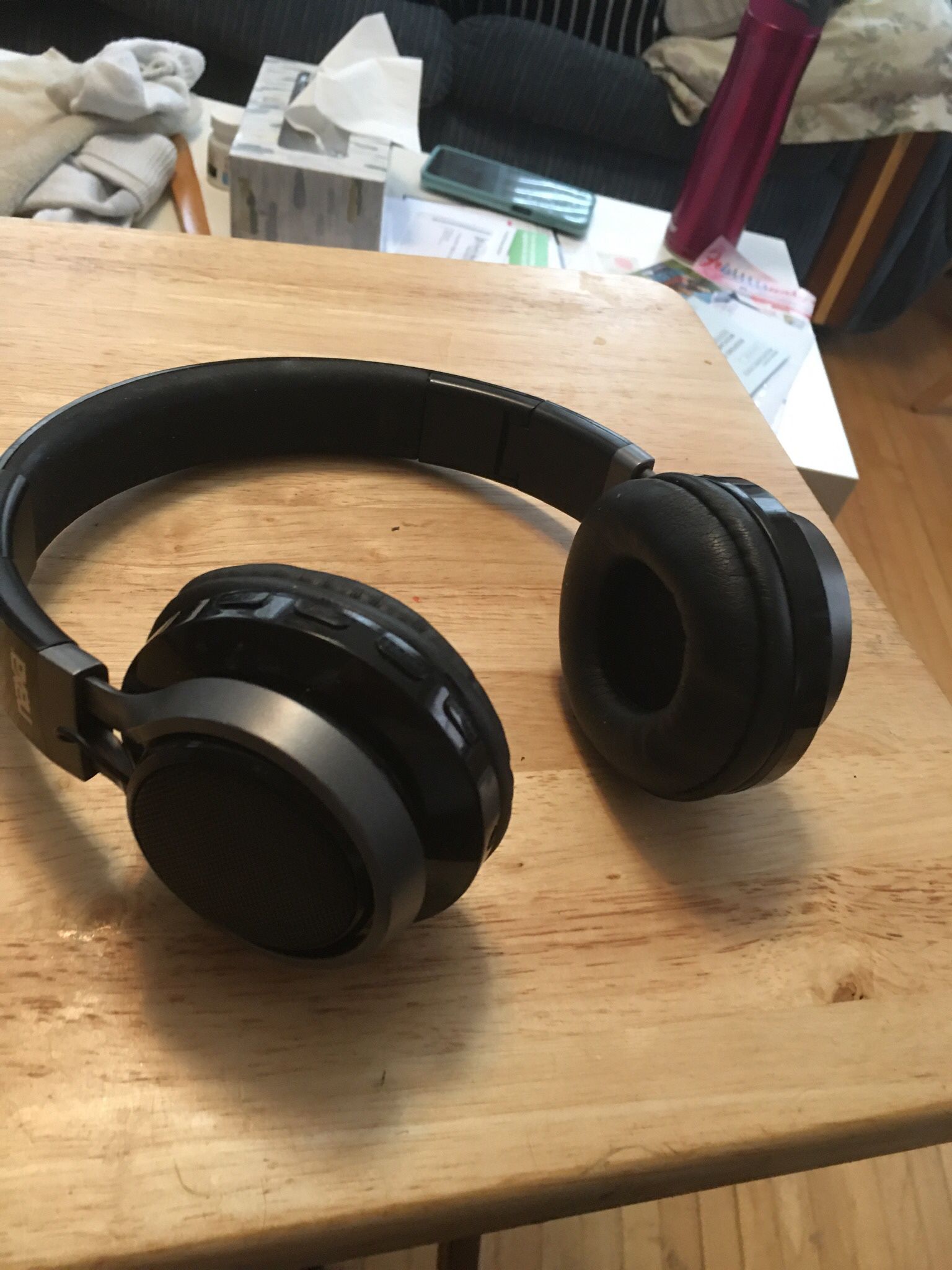 pair of black bluetooth headphones