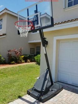 Brand new unopened Spalding 54-Inch Portable Basketball Hoop with Shatter-Proof Polycarbonate Backboard, Adjustable ExactaHeight System & Pro Slam Rim