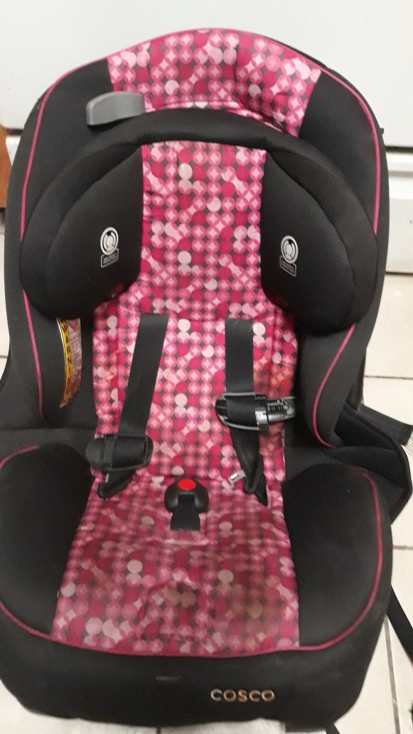 Pink Costco covered toddler car seat. it works just fine. My child just outgrew it