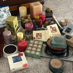Candles, candle holders/plates. candle warmer. one lot