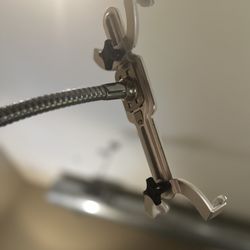 Flexible gooseneck tablet holder with sturdy base.
