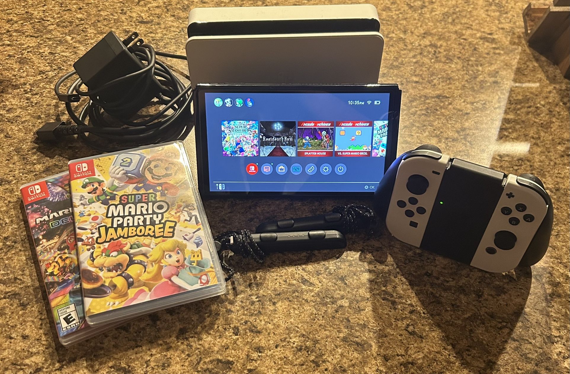 Nintendo switch oled (with 8 games and 4 accounts)