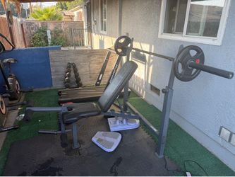 Weight bench bar and a few plates