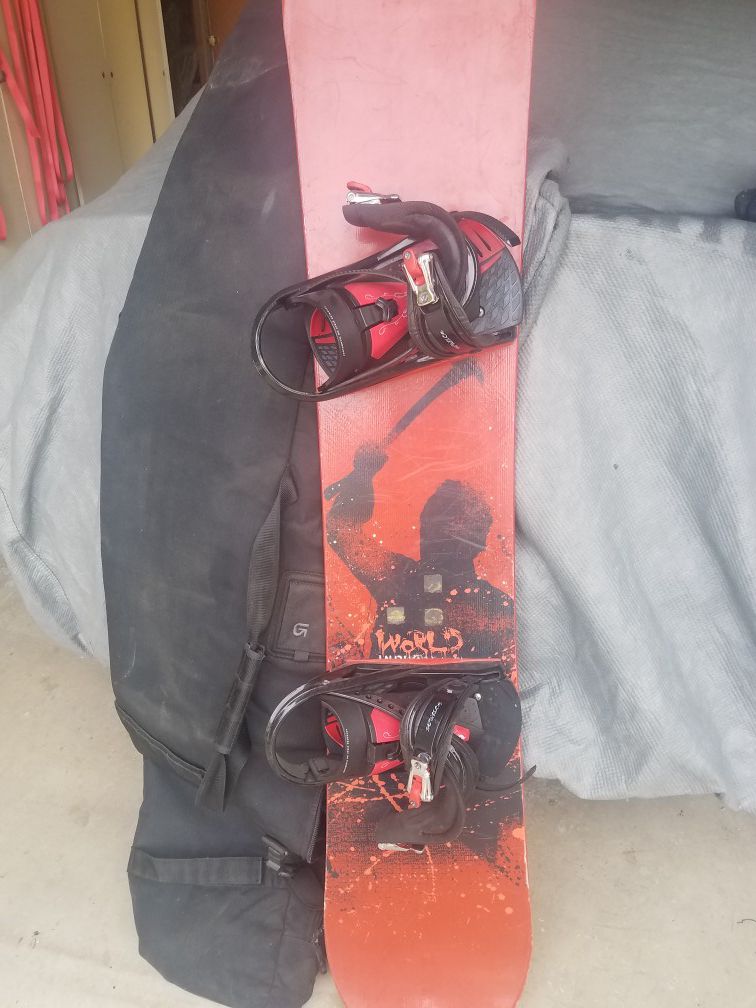 Snowboard with bindings and bag bag