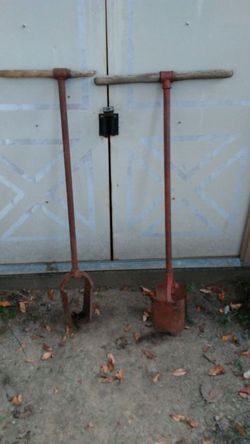 2 very old post hole diggers in great shape