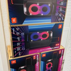 The JBL Partybox Stage 320 is a portable speaker designed for parties and outdoor events. It features a black body with colorful lighting effects on t