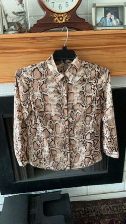 Polyester (feels silky),   bottom down blouse