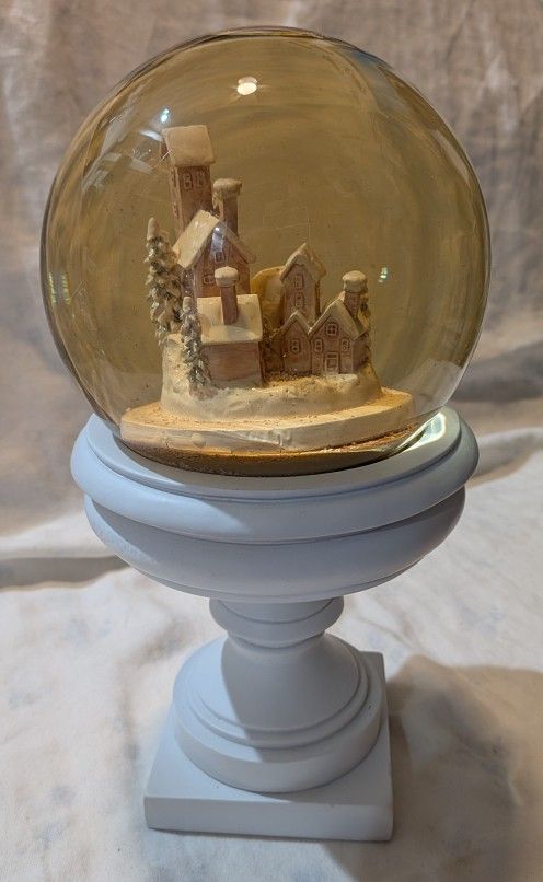 Holiday Snow Globe With Homes And White Base.