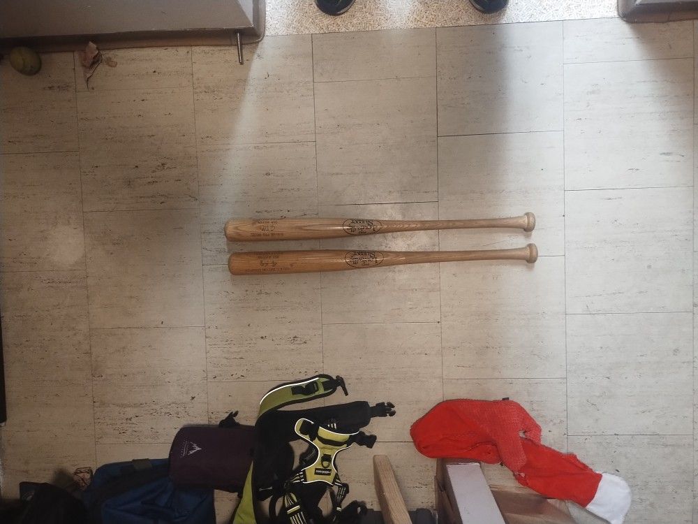 Two 90s souvenir Mariners Louisville Slugger wood bats a