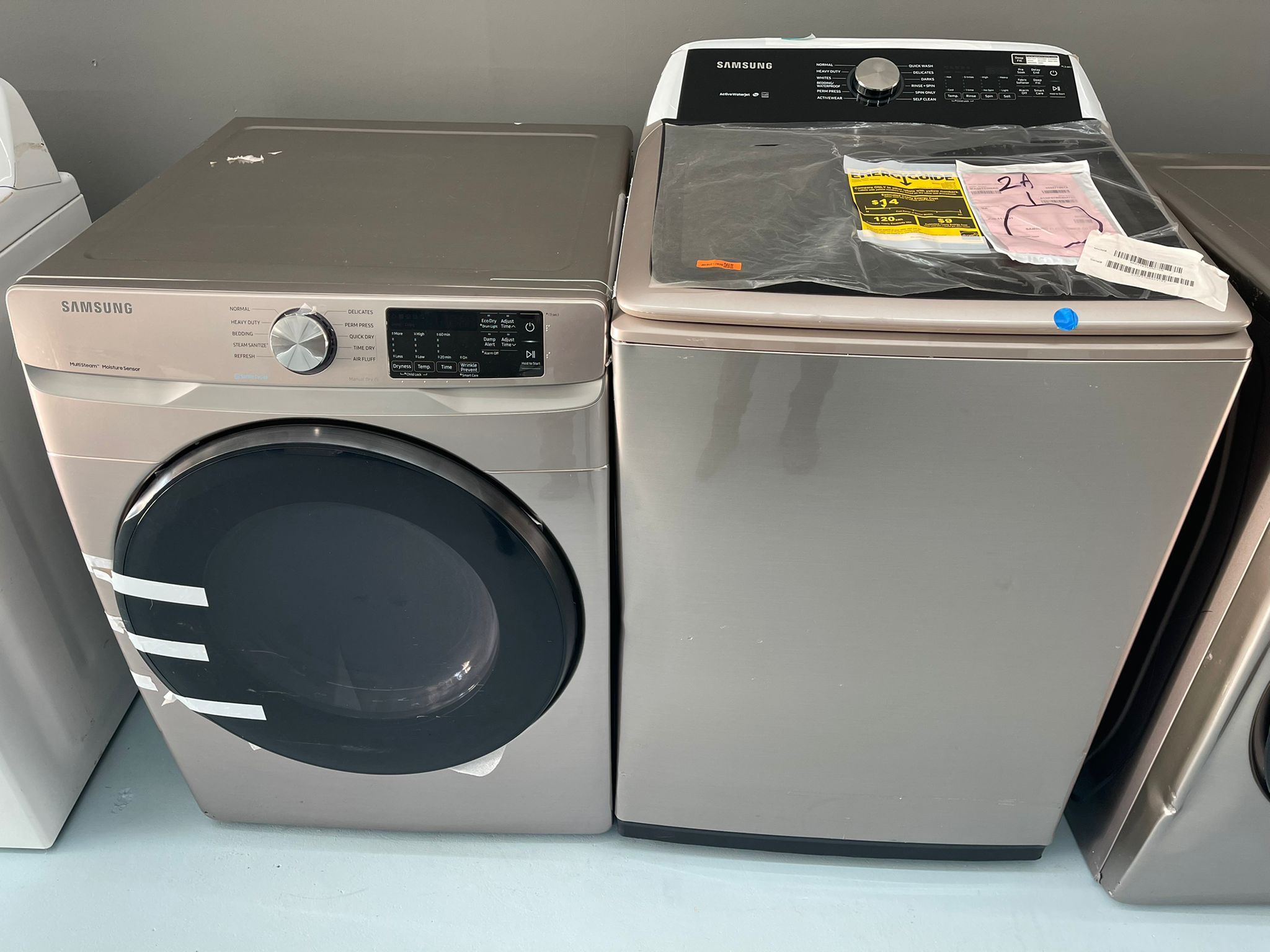 Champagne Samsung Top Load Washer And Electric Dryer Set