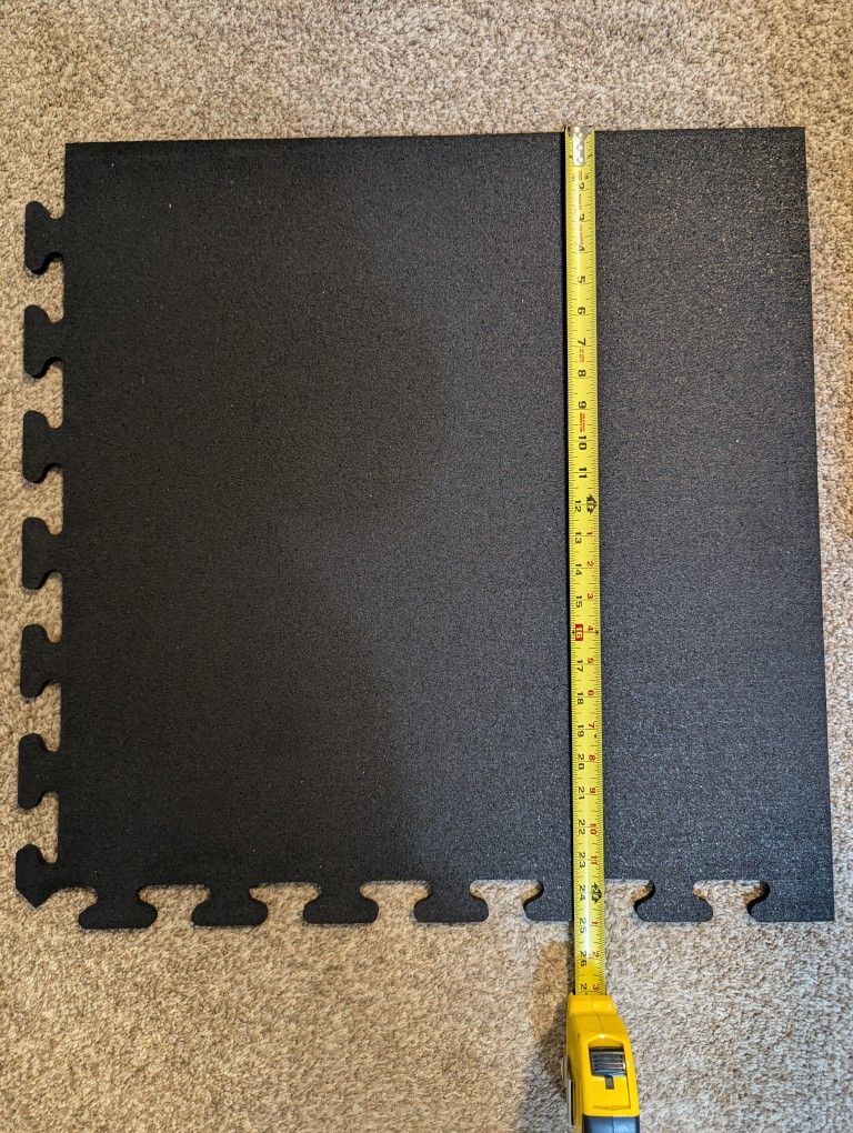 Interlocking rubber floor tiles