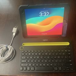 iPad 9th Gen 64 GB with Logitech Bluetooth keyboard and charger.