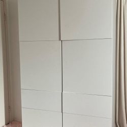 two ikea white tall dresser